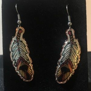 Feather like shape earrings.
